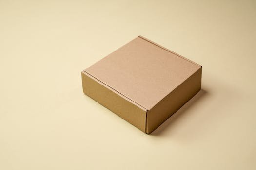 Home Simple cardboard box displayed on a neutral surface, ideal for product packaging visuals.